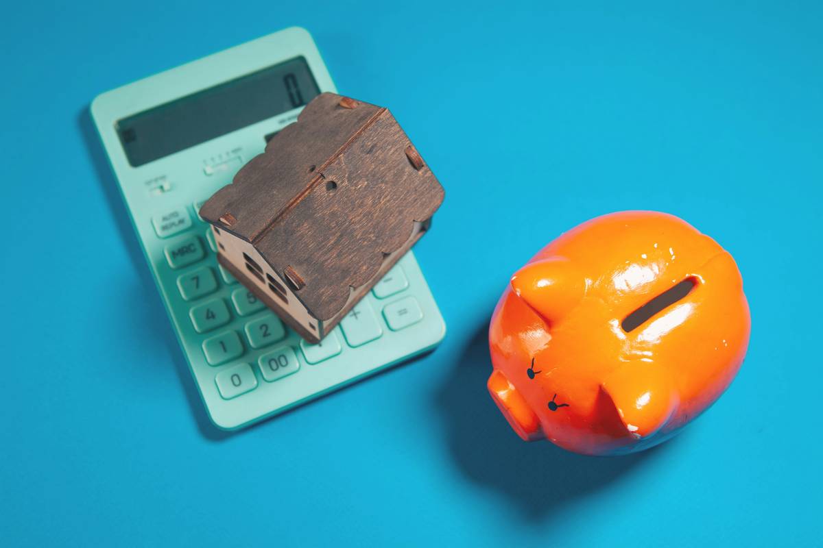passive vs non passive rental income illustrated with a calm investor relaxing versus a stressed landlord fixing a sink
